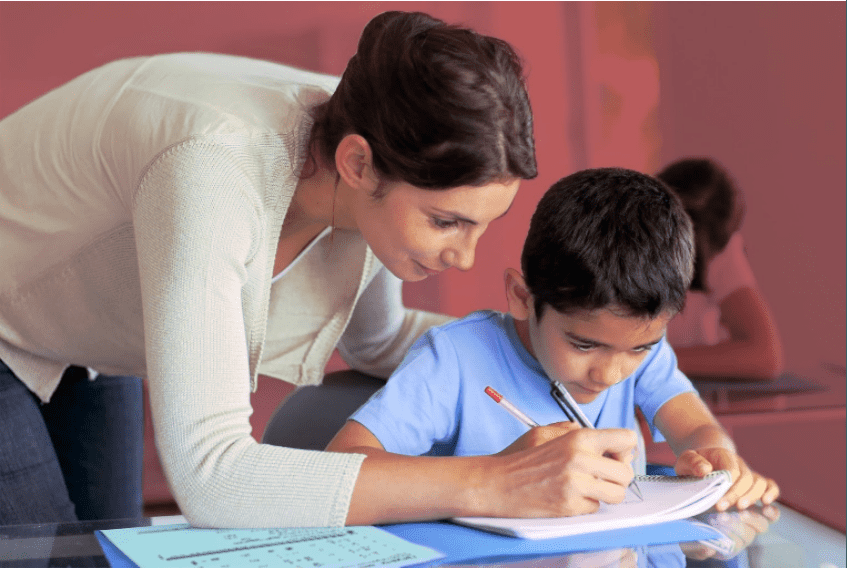 Teacher guiding student in class